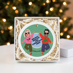 Custom face photo ceramic Christmas ornament in an open white gift box with shredded paper