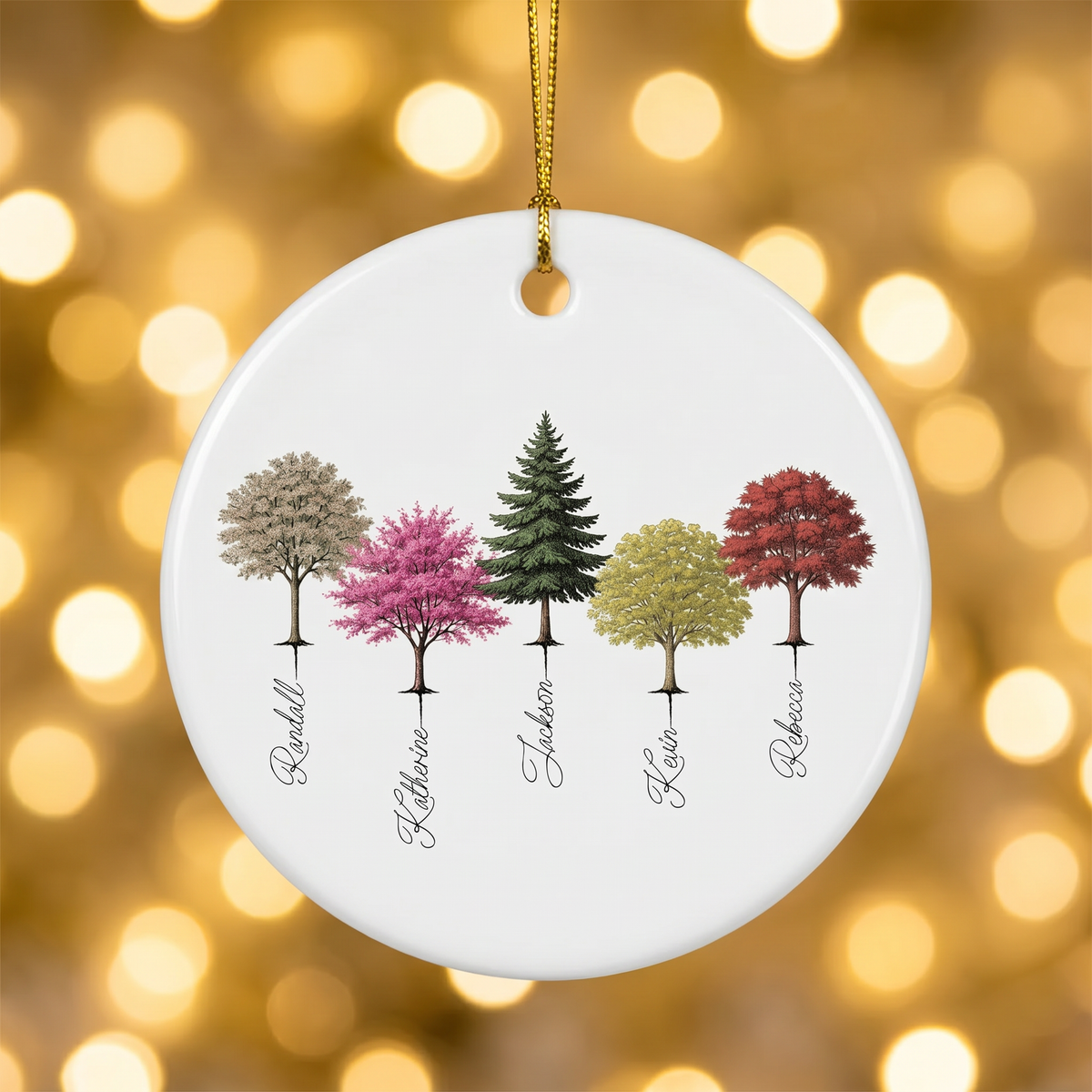 My Forest woodland ceramic Christmas ornament hanging against warm golden holiday bokeh