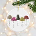Custom My Forest woodland ceramic Christmas ornament hanging on a pine branch with warm holiday lights