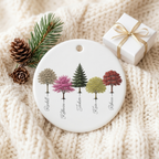 Personalized My Forest ceramic Christmas ornament on a cream knit blanket with pine and a gift