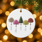 My Forest woodland ceramic Christmas ornament hanging on a pine branch with golden Christmas lights