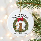 Custom dog Christmas ceramic ornament hanging on a pine branch with warm holiday lights