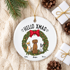 Personalized dog ceramic Christmas ornament on a cream knit blanket with pine and a gift