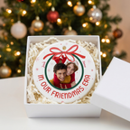In Our Era ceramic Christmas ornament in an open white gift box with shredded paper