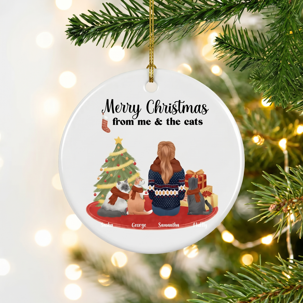 Me and the cats personalized cat lover ceramic Christmas ornament hanging on a pine branch with holiday lights