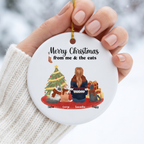 Hand holding a me and the cats cat lover ceramic Christmas ornament in a white knit sweater