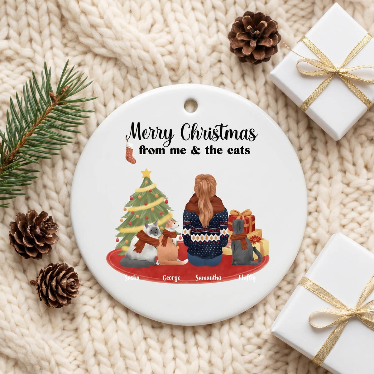 Cat lover ceramic Christmas ornament on a cream knit blanket with pine and a gift