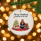 Cat lover ceramic Christmas ornament hanging on a pine branch with golden Christmas lights