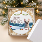 Merry Woofmas French Bulldog ceramic ornament for Mojo in an open white gift box with shredded paper filler