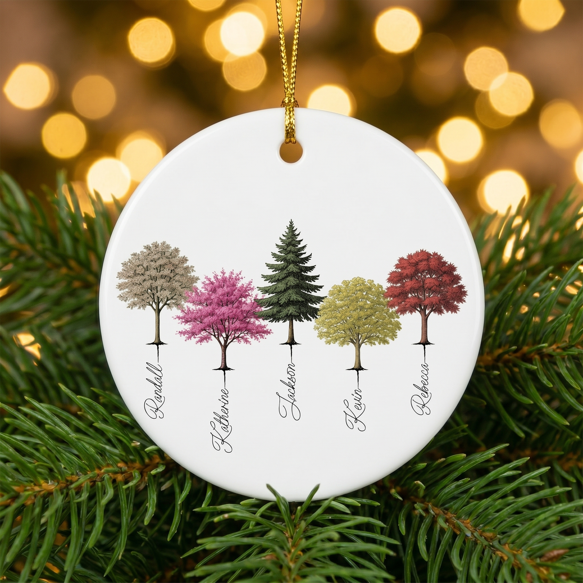 My Forest family tree ceramic ornament nestled in pine branches with golden Christmas lights
