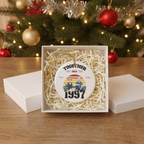 Together Since 1997 ceramic ornament in an open white gift box with shredded paper filler