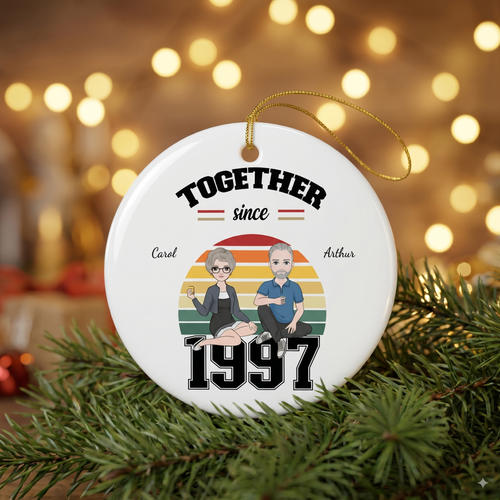 Together Since 1997 personalized ceramic ornament for Carol and Arthur with a clipart couple, on a pine branch
